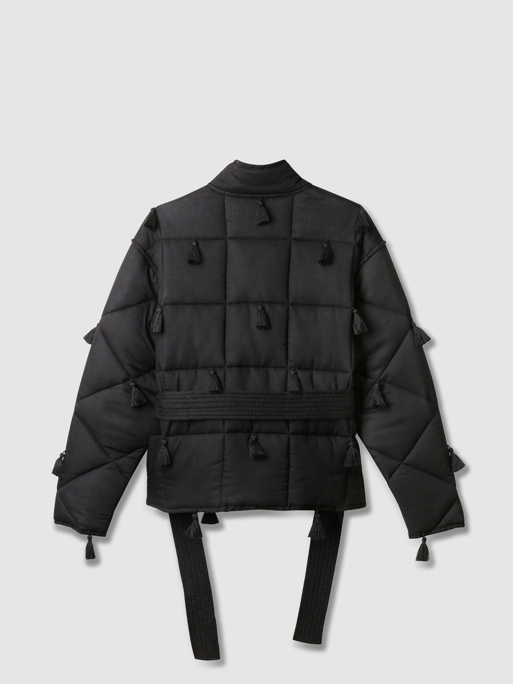 Black Dromen Tassel Jacket back with tassel details on a light gray background