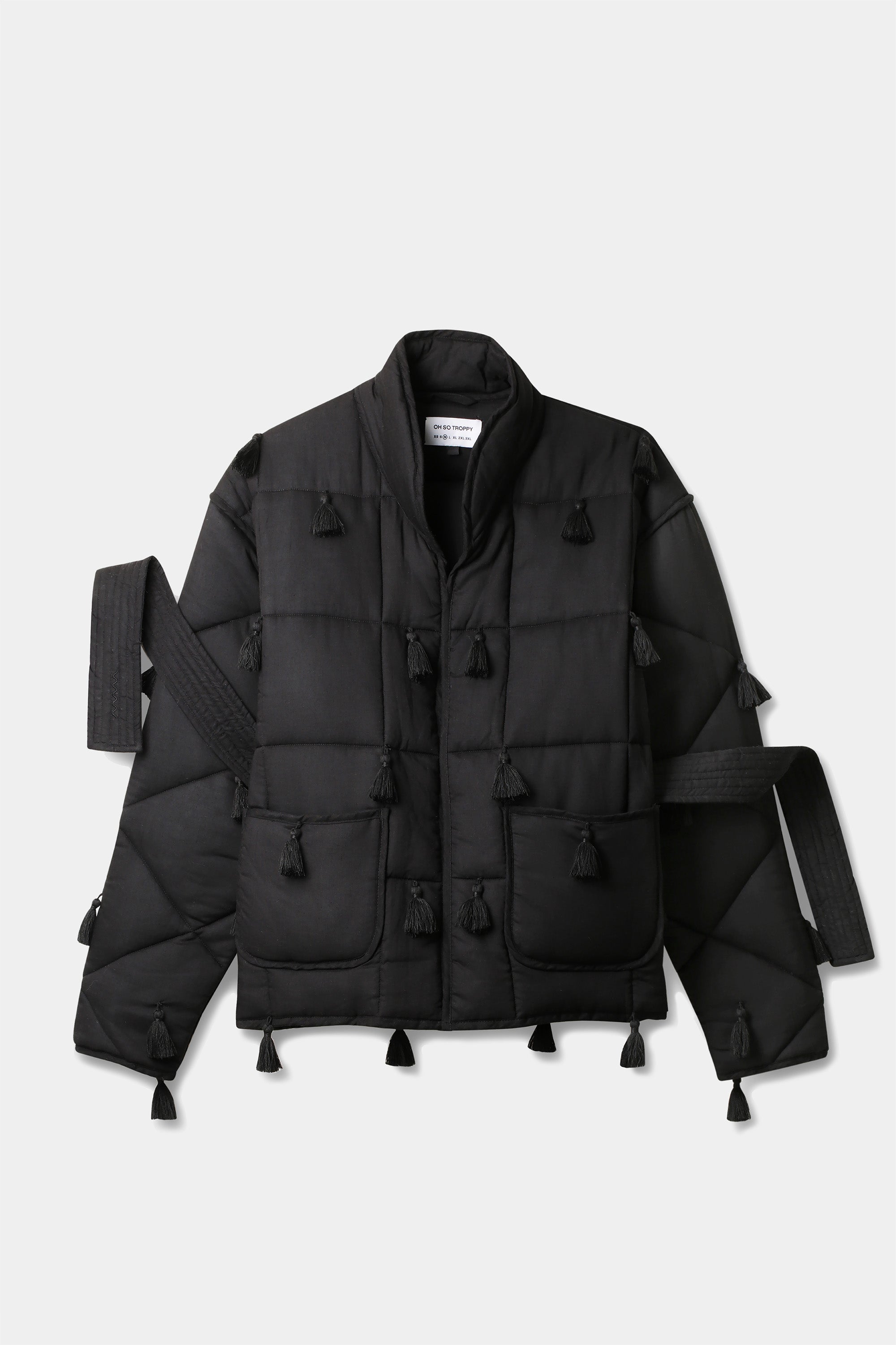 Black Dromen Tassel Jacket with tassel details on a light gray background