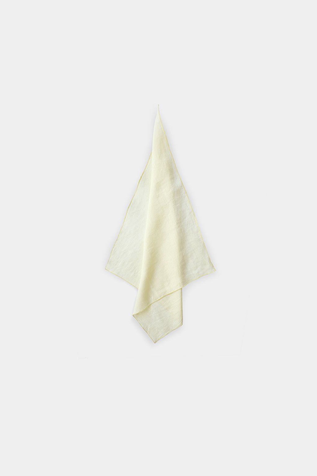 A pale lemon linen scarf, folded and displayed against a solid light gray background.