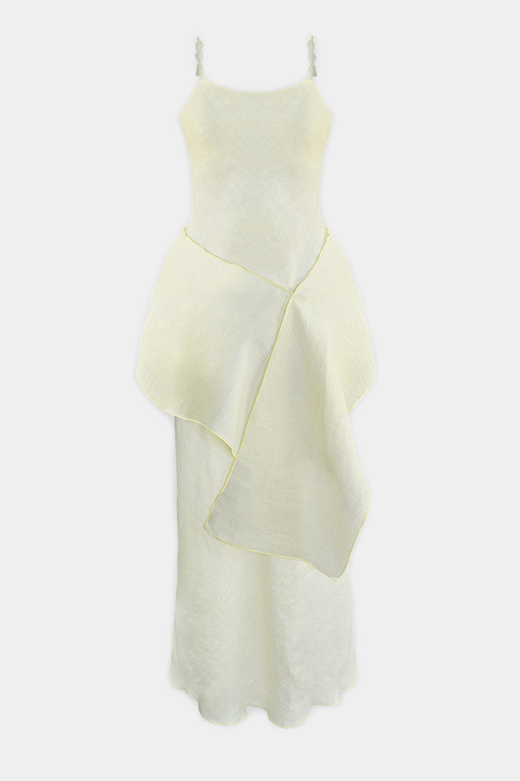 A pale lemon sleeveless dress with thin shoulder straps and beads, a fitted bodice, and an asymmetrical draped overlay, shown against a plain light gray background.