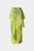A bright citrus skirt with wrap with a subtle check pattern, draped over a mannequin torso against a light gray background.